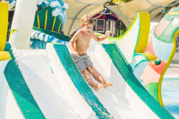 The boy is having fun in the water park.