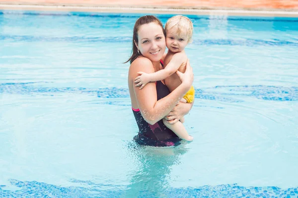 Young Mother Teaching Little Son How Swim Swimming Pool Daytime Royalty Free Stock Photos