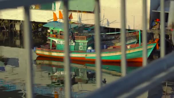 View on a estuary of a river filled with fishing boats at a sunset time. Vietnam. Phu Quoc island — Stock Video