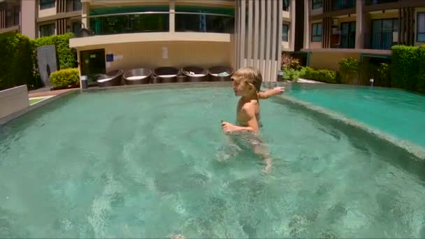 Slow Motion Child Boy Having Fun Time Resort Swimming Pool — Stock Video