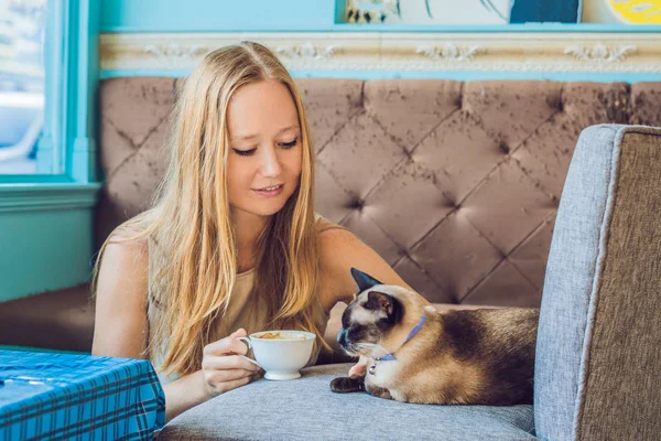 Young Woman Drinking Coffee Stroking Cat — Stock Photo, Image