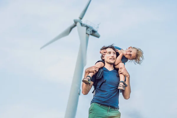Father carrying son on shoulders and waving their arms like a windmill — Stock Photo, Image