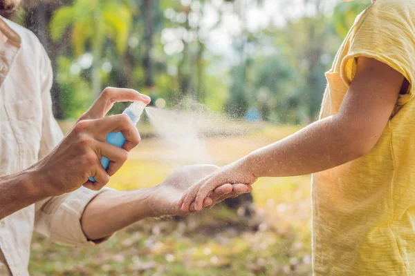 Closeup Shot Dad Son Use Mosquito Spray Spraying Insect Repellent Royalty Free Stock Images