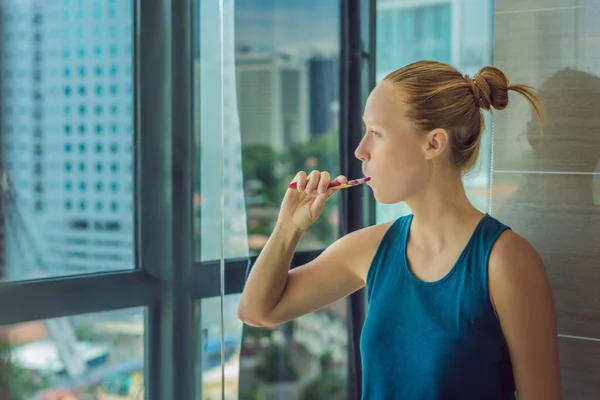 Young Woman Brushing Teeth Standing Window City View — Stock Photo, Image