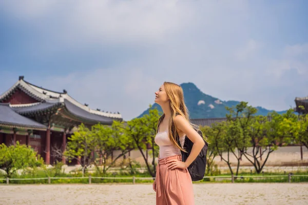 Woman tourist in korea. Gyeongbokgung Palace grounds in Seoul, South Korea. Travel to Korea concept