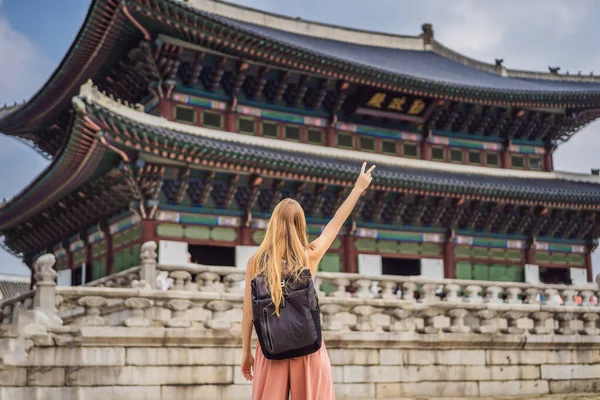 Woman tourist in korea. Gyeongbokgung Palace grounds in Seoul, South Korea. Travel to Korea concept