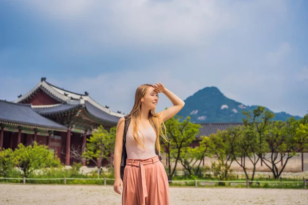 Woman tourist in korea. Gyeongbokgung Palace grounds in Seoul, South Korea. Travel to Korea concept