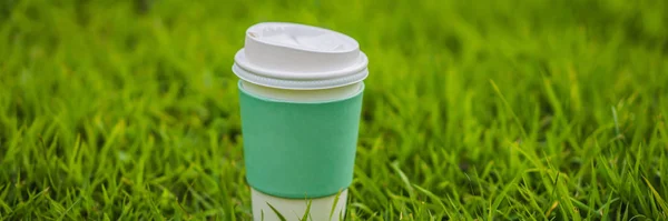Paper cup of coffee on the grass BANNER, LONG FORMAT — Stock Photo, Image