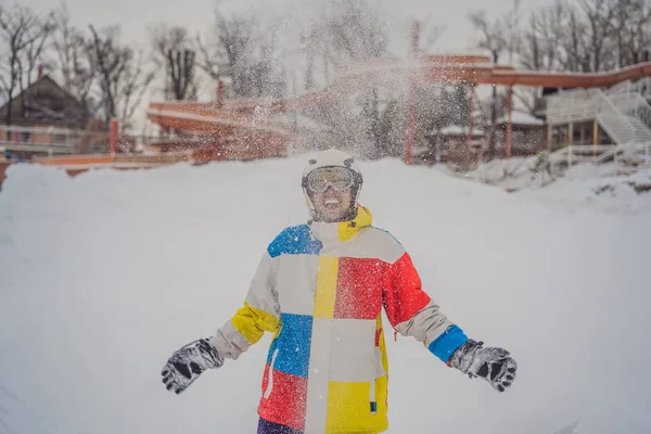 A man throws snow and enjoys the winter, outside — Stock Photo, Image