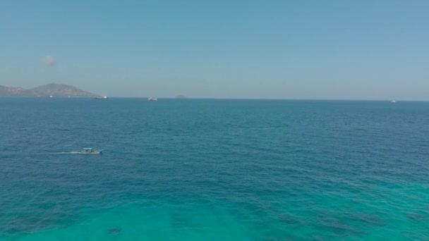 Aerial shot of traditional Balinese boats in an open sea. Travel to Indonesia concept — 비디오