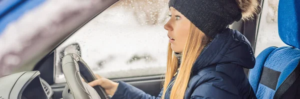 Woman in a car during a snowfall, problems on the road BANNER, LONG FORMAT — Stock Photo, Image