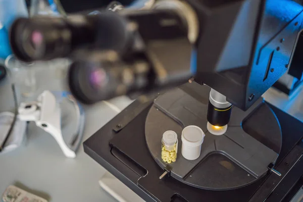 Science lab research safe of new drugs, microscope and pills coronavirus — Stock Photo, Image