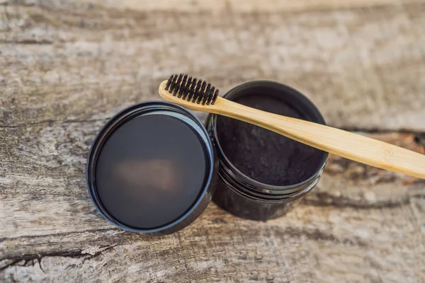 Activated charcoal powder for brushing and whitening teeth. Bamboo eco brush — Stock Photo, Image