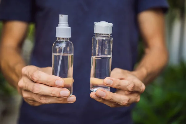 Mens hands using wash hand sanitizer gel — Stock Photo, Image