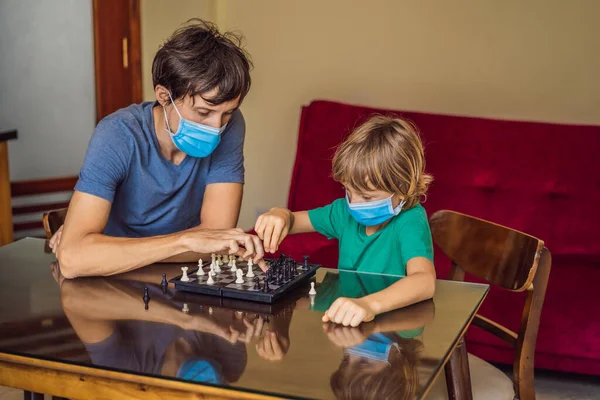 Happy Family Playing Board Game At Home. Stay at home due to quarantine. Coronovirus infection