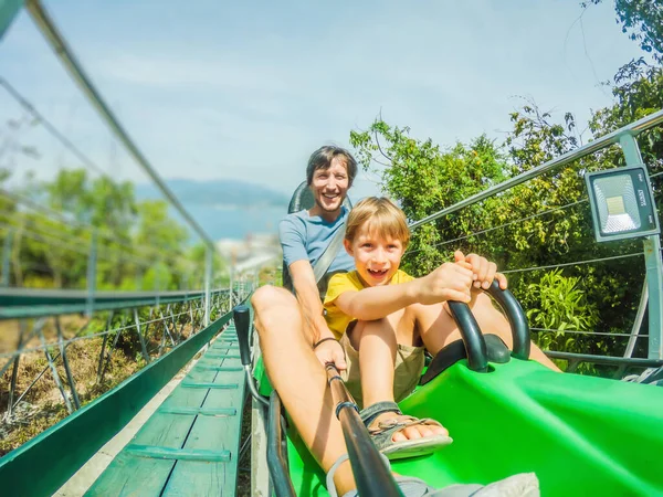Father and son on the alpine coaster — Stock Photo, Image