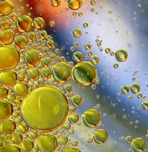 Aceite en círculos abstractos de agua — Foto de Stock