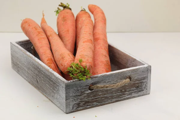 A stack of orange Carrots on a wooden background — Stock Photo, Image