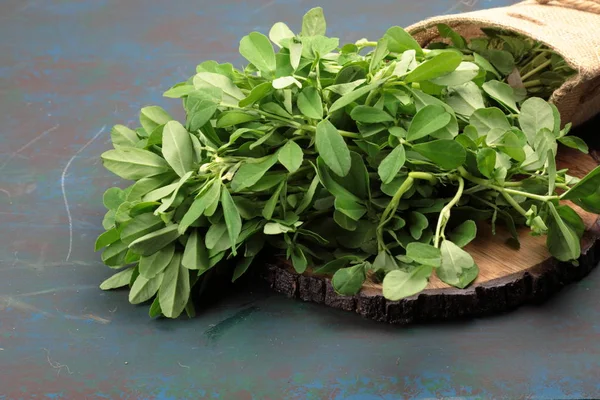 Fenugreek leavs or Methi leaves in a burlap bag — Stock Photo, Image