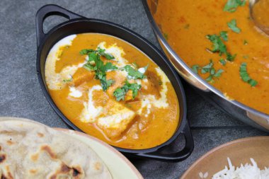 Paneer Butter Masala , a rich and creamy Indian dish made of Pan