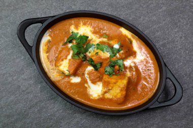 Paneer Butter Masala , a rich and creamy Indian dish made of Pan