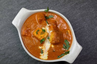 Paneer Butter Masala , a rich and creamy Indian dish made of Pan