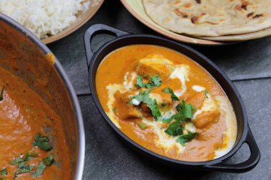 Paneer Butter Masala , a rich and creamy Indian dish made of Pan