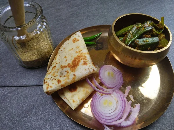 Bhindi Masala or stuffed Bhindi or okra, an Indian vegetable  on a plate with copy space.