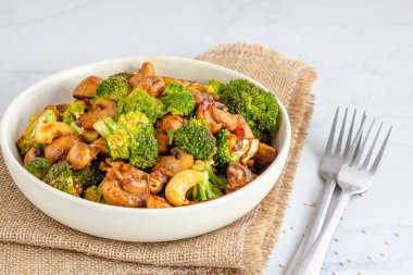 Stir Fried Broccoli and Mushroom in a Bowl on White Background, Vegan Food Photography