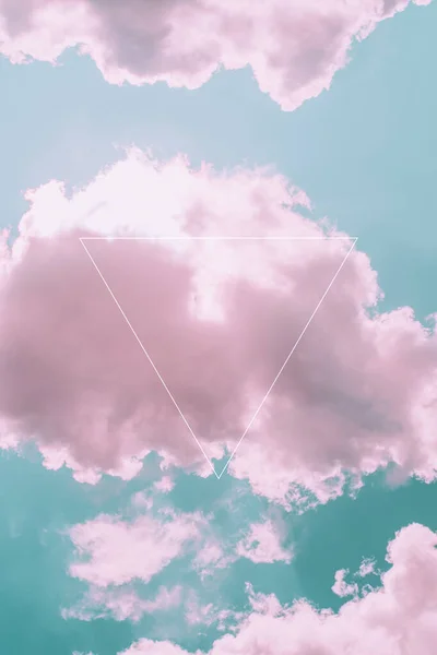 Aesthetic art collage with beautiful turquoise sky with pink clouds and triangle light frame. Minimal