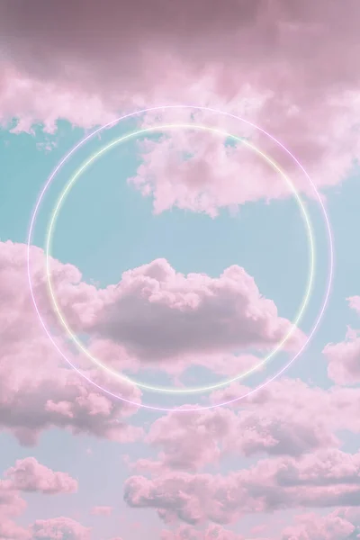 Aesthetic art collage with beautiful turquoise sky with pink clouds and two circle light frames. Angel paradise concept