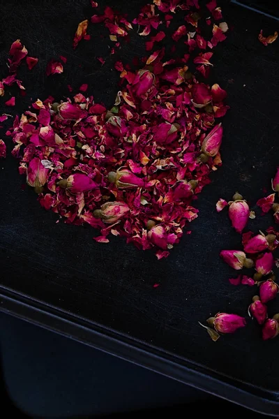 Dried rose petals in heart shape