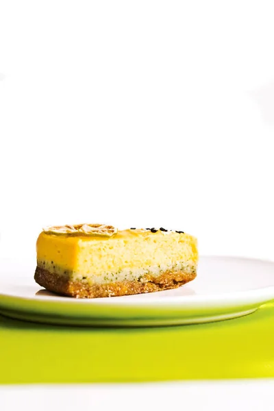 Healthy lemon and lime cake cut on a white background — Stock Photo, Image