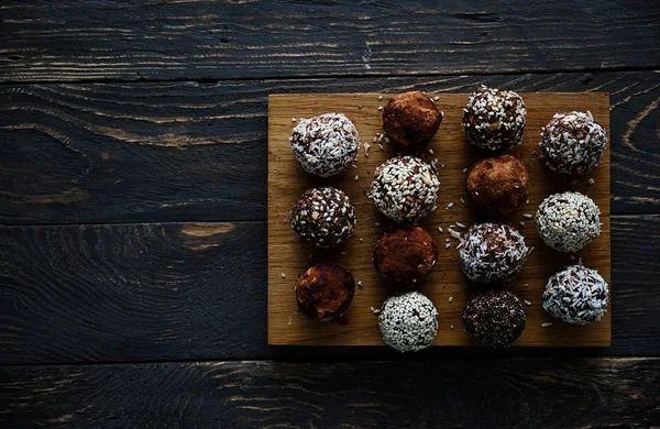 Healthy vegan raw energy balls with cocoa, coconut, sesame, chia Stock Picture