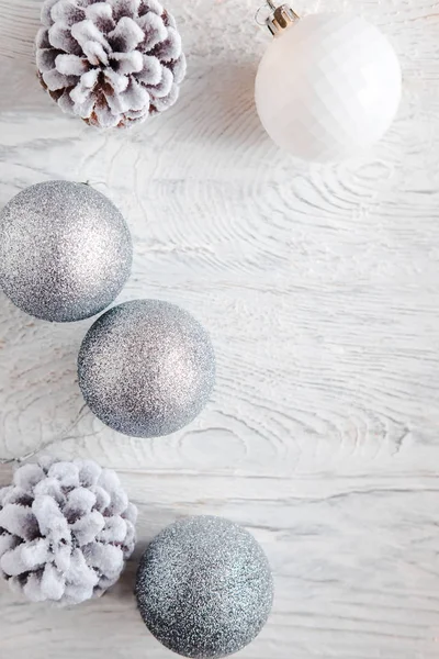 Silver Christmas background on white wooden table