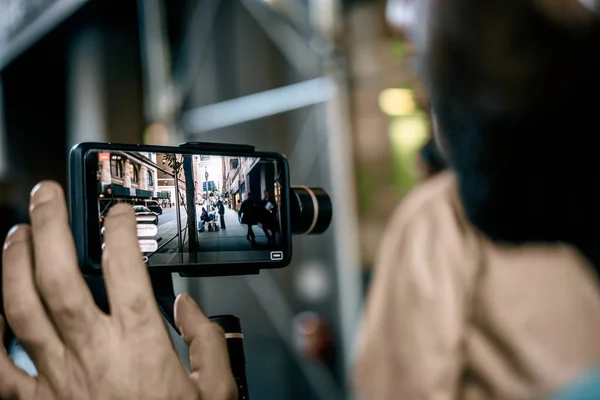 Man doing live video with phone with stabilizer  in NY Royalty Free Stock Photos