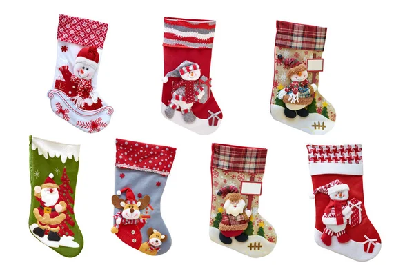 Hediyeler için Noel dekoratif çorabı. Yılbaşı çorapları ve oyuncakları. İzole, beyaz arkaplan.