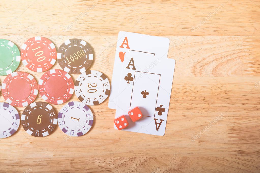 Gambling chips and cards on a Casino table