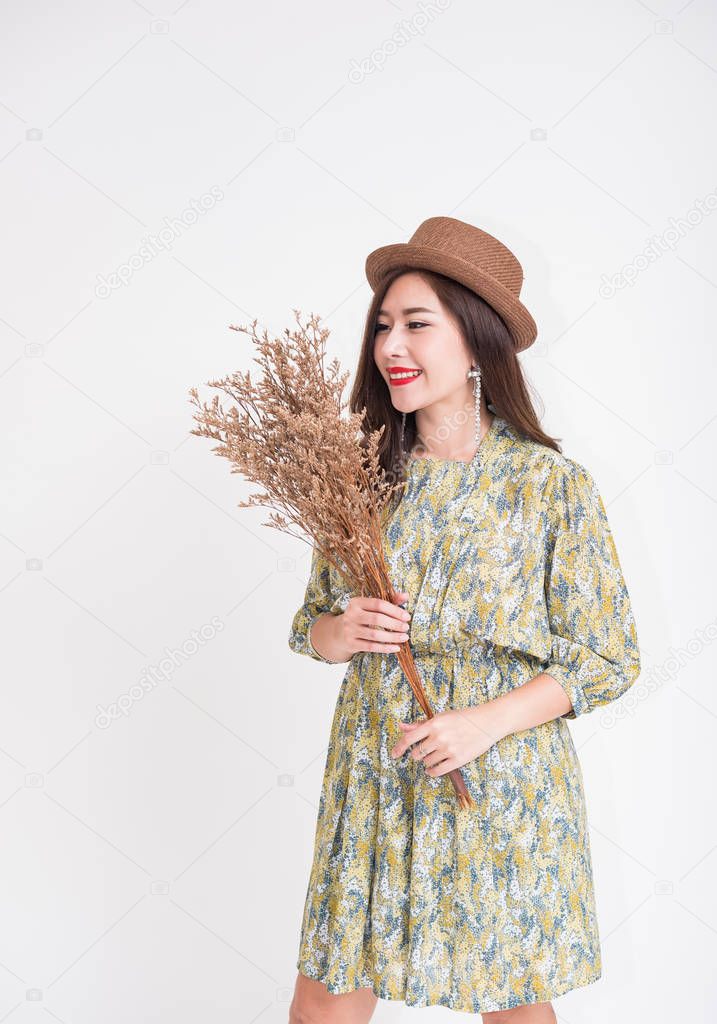 Beautiful young Asian woman with vintage style on white background 