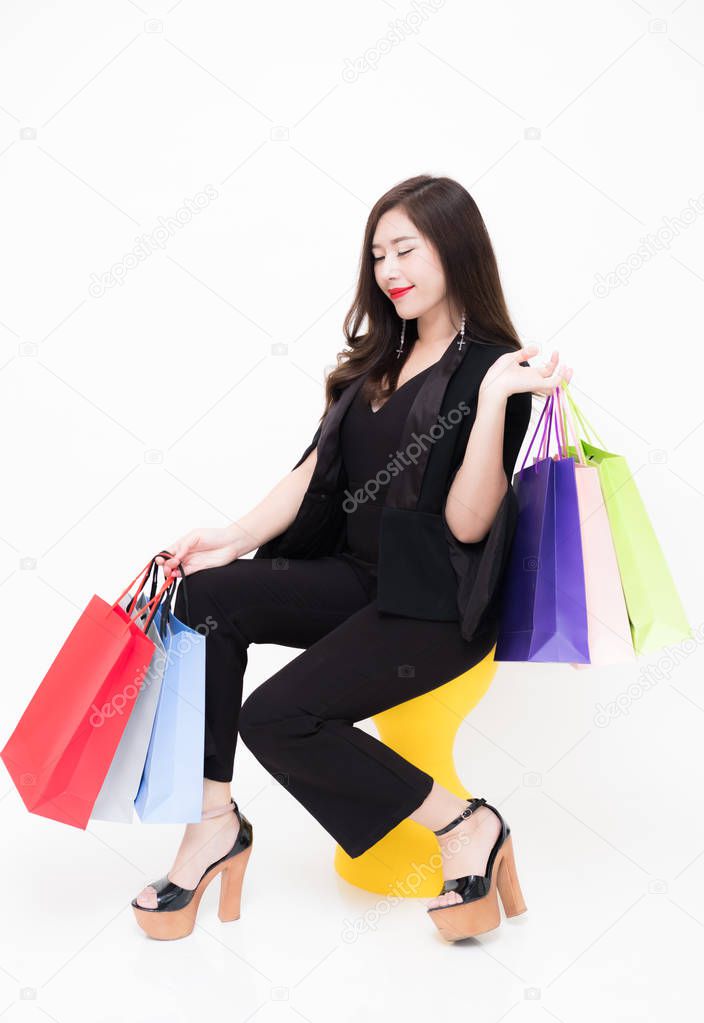 Portrait of young asian woman happy smiling with shopping bags