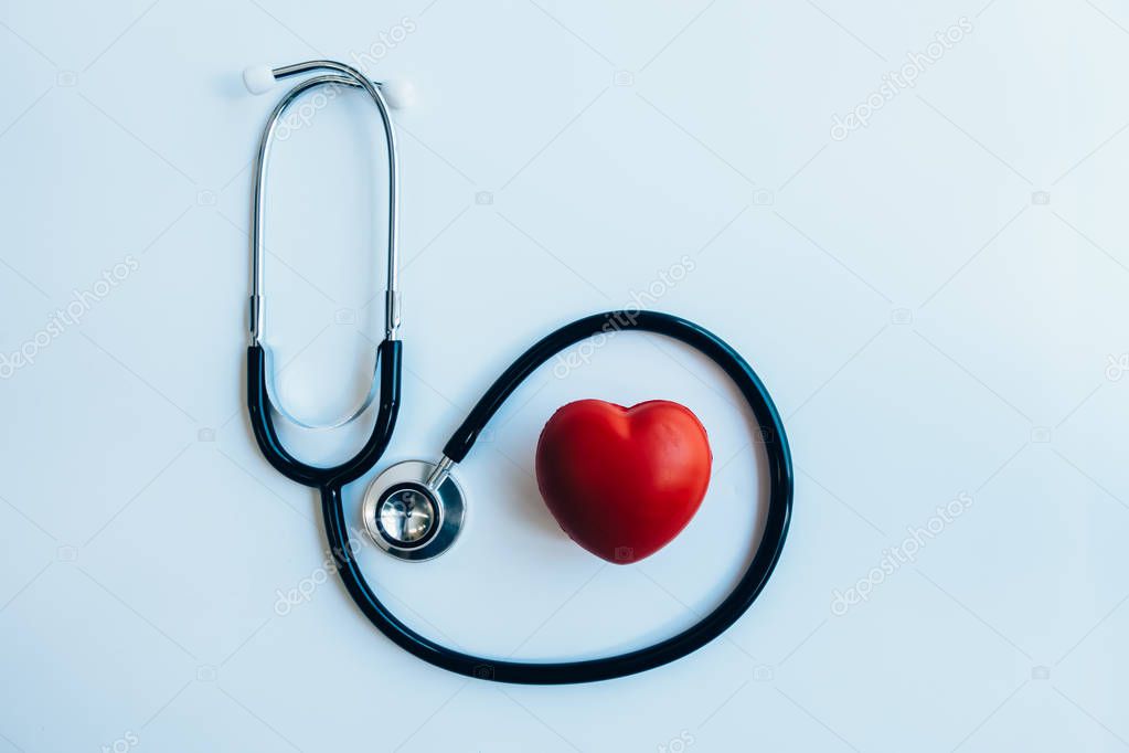 close up red heart and stethoscope on white background, world health day concept, process vintage tone