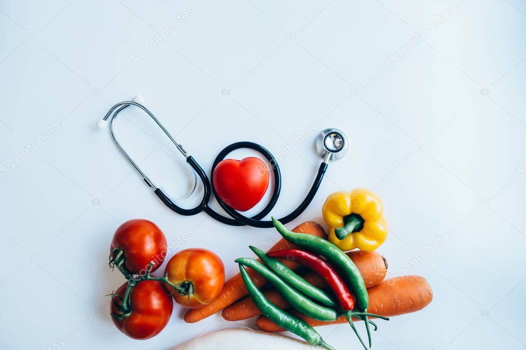 close up red heart and stethoscope on white background, world health day concept, process vintage tone