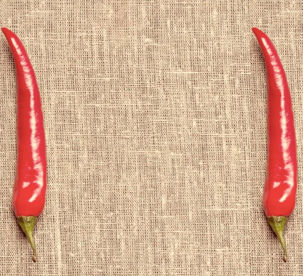 red hot chili peppers lying on bamboo wooden board