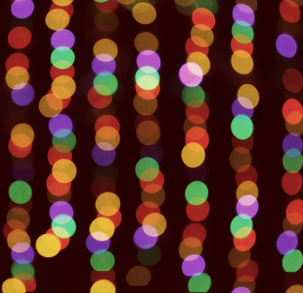 bokeh circles of different colors of light on a black background