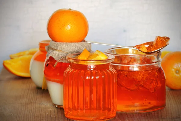 jelly orange oranges placed on a table next to attributes