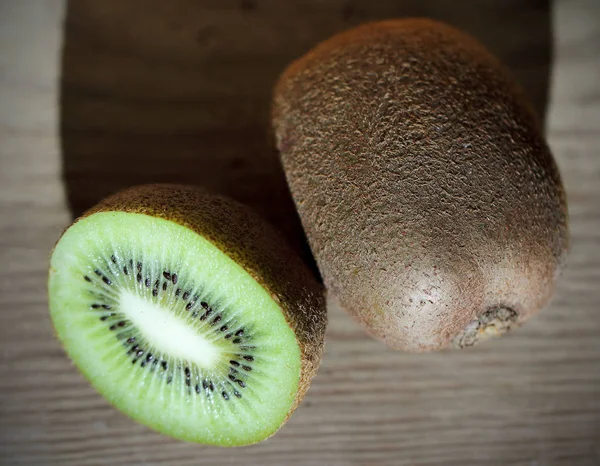 Kiwi fresh green lies on the table background