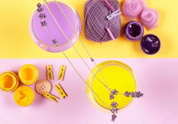 Objects purple and yellow are on the table