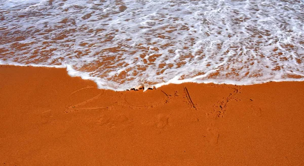 Írott-ban homok, trópusi tengerparton 2017. — Stock Fotó