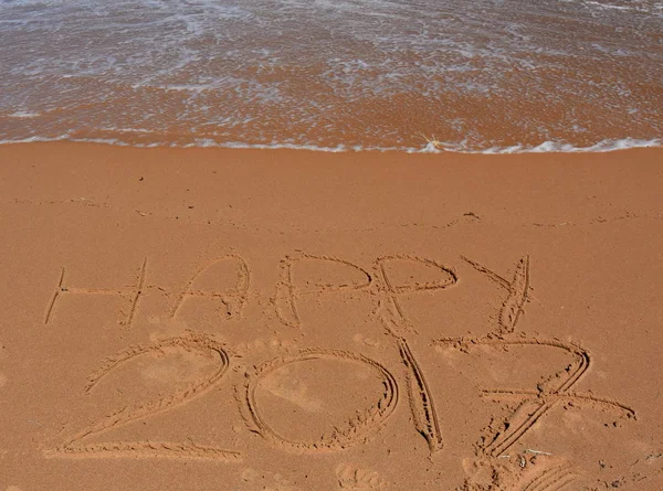 Happy 2017  written in sand, on tropical beach. — Stock Photo, Image