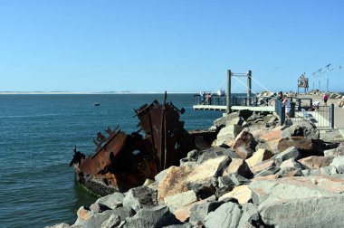 The wreck of the Adolphe on Stockton breakwall (Newcastle, NSW, Australia). The Adolphe was a sailing ship that was wrecked at the mouth of the Hunter River, in 1904.  clipart